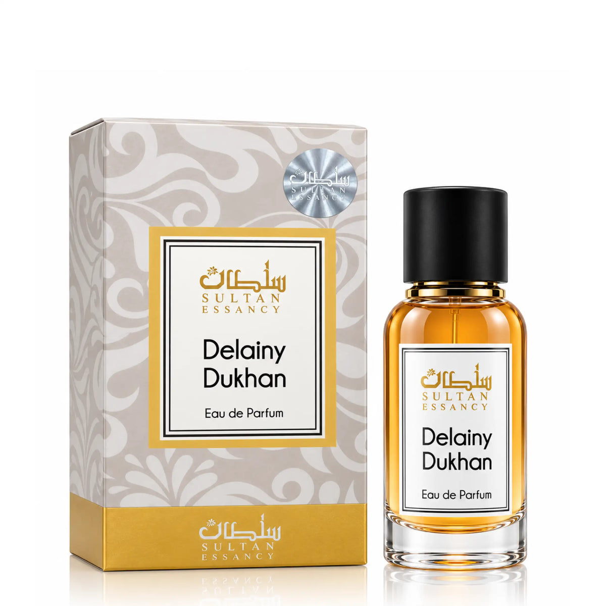 Delainy Dukhan Eau de Parfum für Herren von Sultan Essancy – transparenter Glasflakon mit goldgelber Flüssigkeit und schwarzer Kappe neben der eleganten creme-goldenen Verpackung.